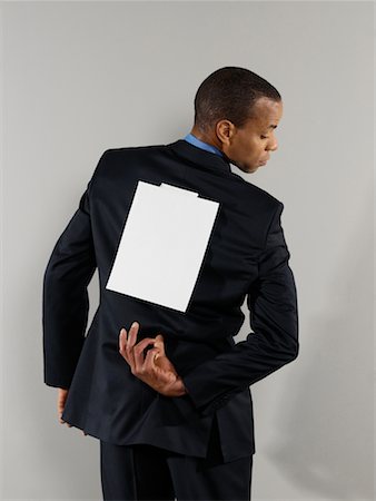 Businessman with Blank Paper on His Back Stock Photo - Rights-Managed, Code: 700-00659396