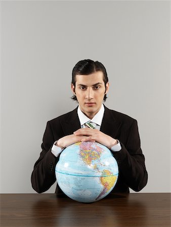 Portrait of Businessman Holding Globe Stock Photo - Rights-Managed, Code: 700-00659487