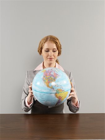 Portrait of Businesswoman Holding Globe Stock Photo - Rights-Managed, Code: 700-00659482