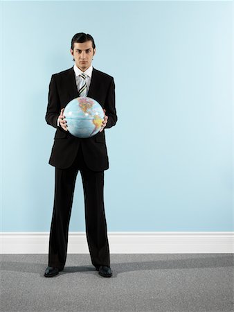 Portrait of Businessman Holding Globe Stock Photo - Rights-Managed, Code: 700-00659490