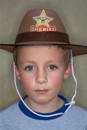 simsearch:700-02046160,k - Boy Wearing Cowboy Hat Foto de stock - Con derechos protegidos, Código: 700-00650088