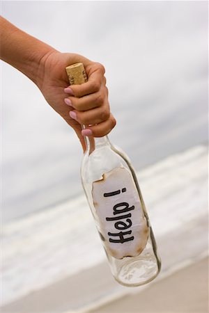 simsearch:700-02080402,k - Woman Holding Message in a Bottle Stock Photo - Rights-Managed, Code: 700-00651530