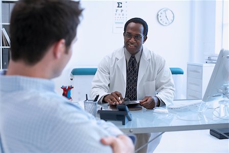 Patient with Eye Doctor Stock Photo - Rights-Managed, Code: 700-00660998