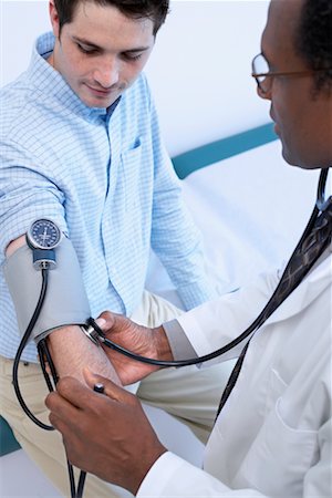 simsearch:700-00616627,k - Doctor Checking Patient's Blood Pressure Stock Photo - Rights-Managed, Code: 700-00661010