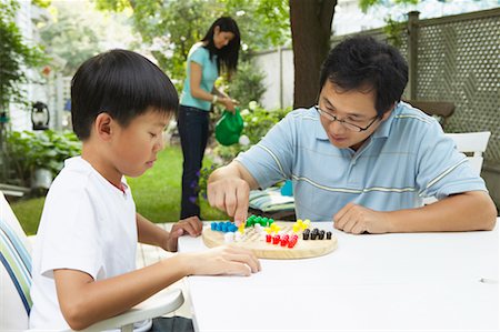 Father Playing Chinese Checkers with Son Stock Photo - Rights-Managed, Code: 700-00686882