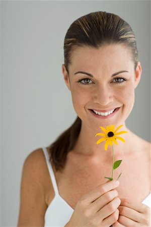Potrait of Woman Holding a Flower Stock Photo - Rights-Managed, Code: 700-00688315