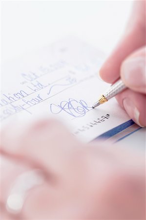 simsearch:700-00085293,k - Person Signing Cheque Stock Photo - Rights-Managed, Code: 700-00688393