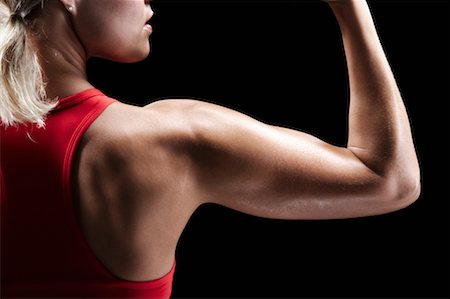 simsearch:700-02200026,k - Femme flexion des biceps Photographie de stock - Rights-Managed, Code: 700-00688648