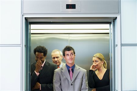 sweaty businessman - Business People on Elevator Smelling Unpleasant Odor Stock Photo - Rights-Managed, Code: 700-00681396