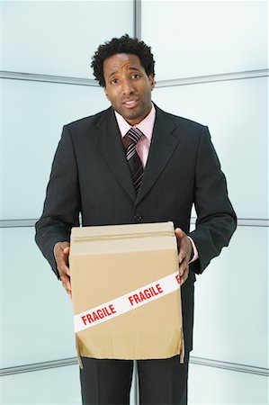 simsearch:700-00681397,k - Businessman holding Box with Fragile Sticker on it Stock Photo - Rights-Managed, Code: 700-00681404