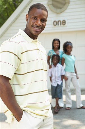 simsearch:873-06441227,k - Man with His Family Standing In Front Of Garage Stock Photo - Rights-Managed, Code: 700-00681561