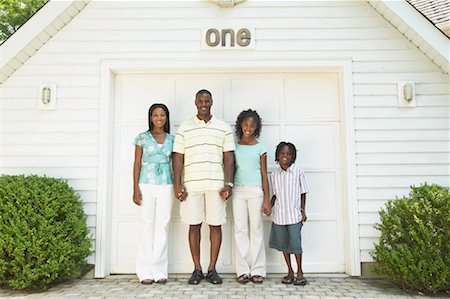 simsearch:873-06441227,k - Family Standing In Front Of Garage Stock Photo - Rights-Managed, Code: 700-00681563