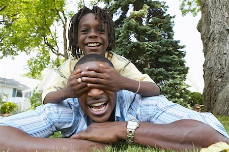 Father and Son Lying On The Grass Stock Photo - Rights-Managed, Code: 700-00681582