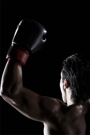 fitness dramatic - Boxer Raising his Arm Stock Photo - Rights-Managed, Code: 700-00683448