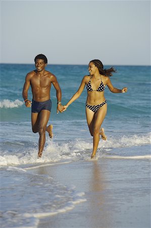 simsearch:700-00530261,k - Cuban Couple Running Along Beach, Cuba Stock Photo - Rights-Managed, Code: 700-00711775