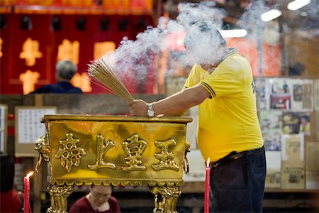 Man Making an Offering at a Temple, Chinatown, Singapore Stock Photo - Rights-Managed, Code: 700-00747762