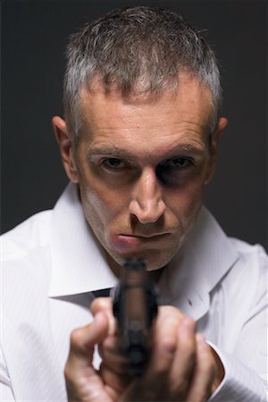 simsearch:700-00546343,k - Man Holding Gun Stock Photo - Rights-Managed, Code: 700-00748043