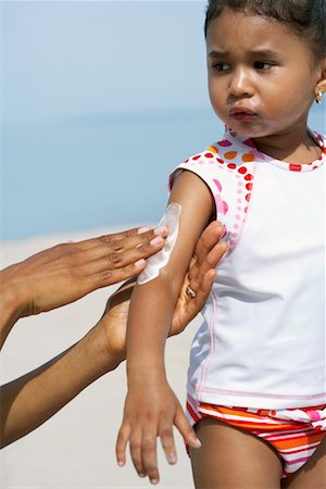 simsearch:600-07311583,k - Mother Applying Sunscreen to Daughter Stock Photo - Rights-Managed, Code: 700-00748178