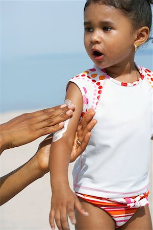 simsearch:600-07311583,k - Mother Applying Sunscreen to Daughter Stock Photo - Rights-Managed, Code: 700-00748179