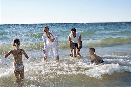 simsearch:700-00092986,k - Family Splashing in Waves Stock Photo - Rights-Managed, Code: 700-00768239