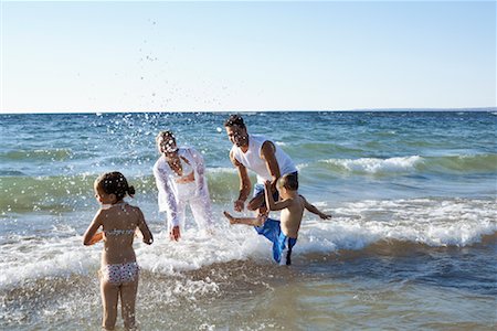 simsearch:700-00083447,k - Family Splashing in Waves Stock Photo - Rights-Managed, Code: 700-00768240
