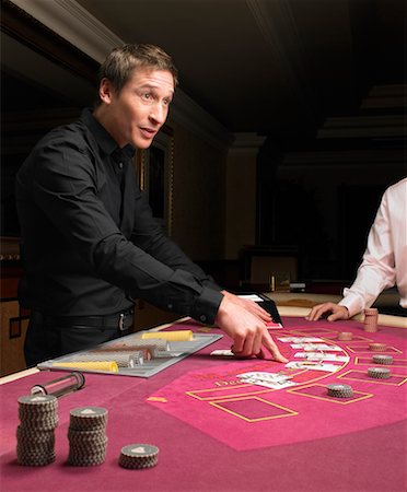 Croupier and Player at Card Table Stock Photo - Rights-Managed, Code: 700-00768630