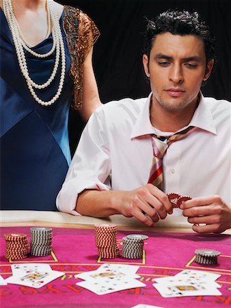 simsearch:700-00768672,k - Man Playing Cards, Woman Standing Behind Him Stock Photo - Rights-Managed, Code: 700-00768650
