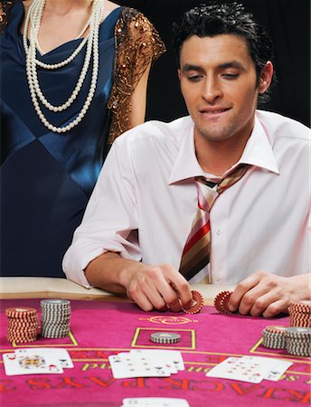 simsearch:700-00768672,k - Man Playing Cards, Woman Standing Behind Him Stock Photo - Rights-Managed, Code: 700-00768651