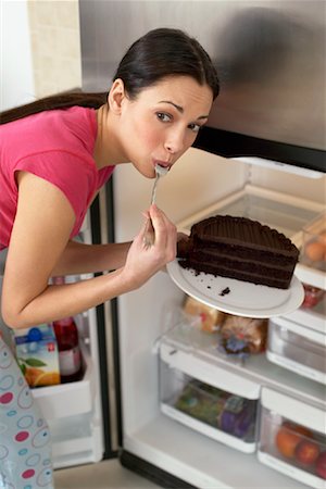 simsearch:700-00477709,k - Woman Eating Cake Stock Photo - Rights-Managed, Code: 700-00787001