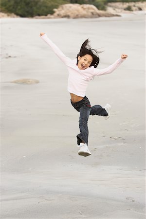 Girl Jumping on the Beach Stock Photo - Rights-Managed, Code: 700-00782116