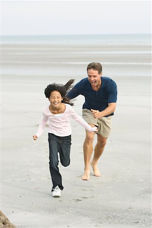 Father and Daughter Running On The Beach Stock Photo - Rights-Managed, Code: 700-00782117