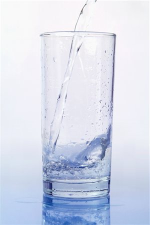 Glass of Water Being Poured Stock Photo - Rights-Managed, Code: 700-00782221