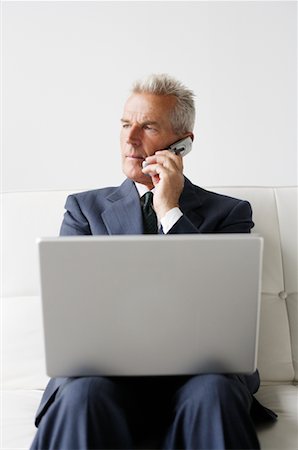 simsearch:700-03058969,k - Businessman Using Cellular Phone and Laptop Stock Photo - Rights-Managed, Code: 700-00782234