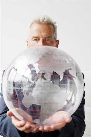 Businessman Holding Globe Stock Photo - Rights-Managed, Code: 700-00782370