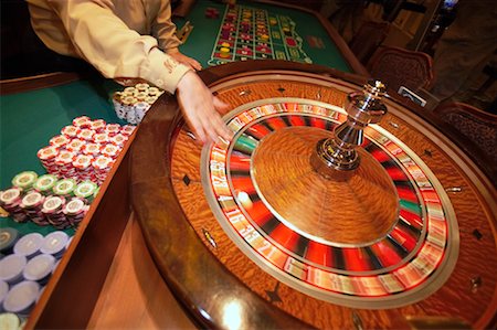 simsearch:700-00035072,k - Person Spinning Roulette Wheel Stock Photo - Rights-Managed, Code: 700-00782391