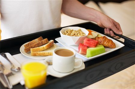 Man Carrying Breakfast Tray Stock Photo - Rights-Managed, Code: 700-00782496