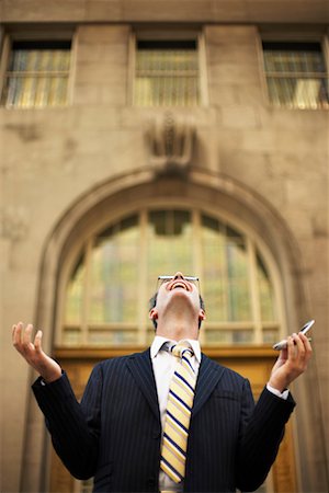 simsearch:700-00163379,k - Businessman Looking Up with Cellular Phone Stock Photo - Rights-Managed, Code: 700-00795870