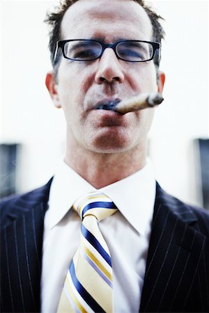 simsearch:700-01015007,k - Businessman with Cigar Stock Photo - Rights-Managed, Code: 700-00795873