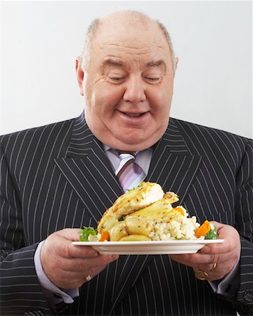 simsearch:640-01350815,k - Portrait of Man Holding Plate of Food Stock Photo - Rights-Managed, Code: 700-00796296
