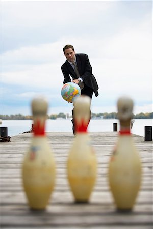 earth pins - Businessman Bowling With Globe Stock Photo - Rights-Managed, Code: 700-00823607