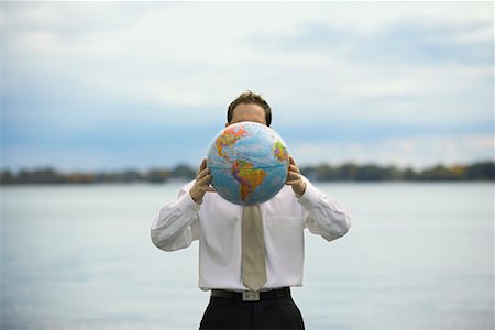 Businessman Holding Globe Stock Photo - Rights-Managed, Code: 700-00823608