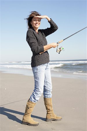 Pêche de femme sur la plage Photographie de stock - Rights-Managed, Code: 700-00846959