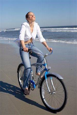 Woman Riding Bike On Beach Stock Photo - Rights-Managed, Code: 700-00846987