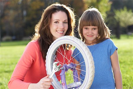simsearch:700-03067843,k - Mother Fixing Bicycle with Daughter Stock Photo - Rights-Managed, Code: 700-00847116