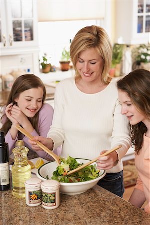 Mother Preparing Salad with Daughters Stock Photo - Rights-Managed, Code: 700-00864979