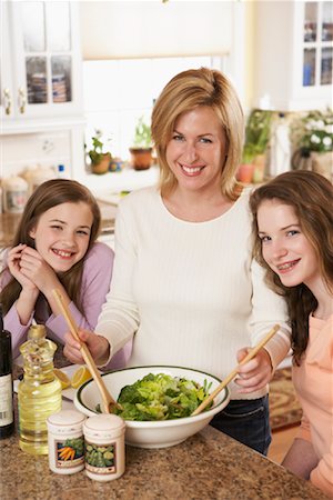 Mother Preparing Salad with Daughters Stock Photo - Rights-Managed, Code: 700-00864980