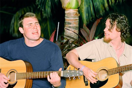 Two Men Playing Guitar and Singing Stock Photo - Rights-Managed, Code: 700-00865215