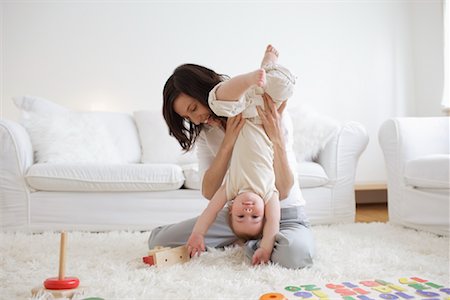 simsearch:700-06645599,k - Woman Playing with Son in Living Room Stock Photo - Rights-Managed, Code: 700-00865694