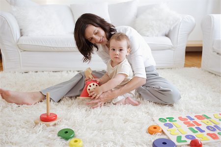 shag carpet - Woman Playing with Son in Living Room Stock Photo - Rights-Managed, Code: 700-00865692