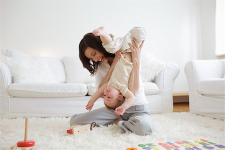 shag carpet - Woman Playing with Son in Living Room Stock Photo - Rights-Managed, Code: 700-00865693